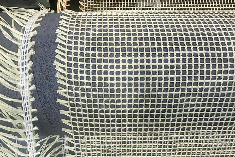 Rolo de tecido de malha reforçado com aramida de alta resistência – para materiais básicos compostos Rolo de tecido de malha reforçado com aramida de alta resistência – para materiais básicos compostos